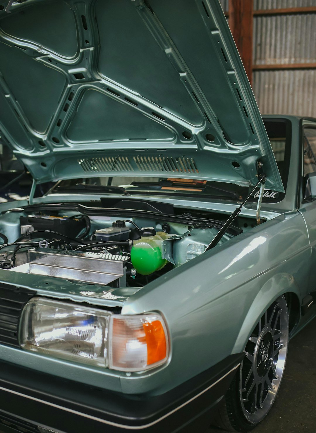 Home light-blue-car-with-hood-open-showing-engine-nobqb-jz05k